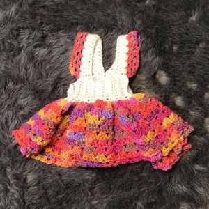 Crocheted baby dress.